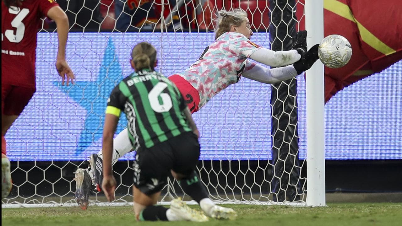 Claudia Jenkins saves Chloe Berryhill's shot.