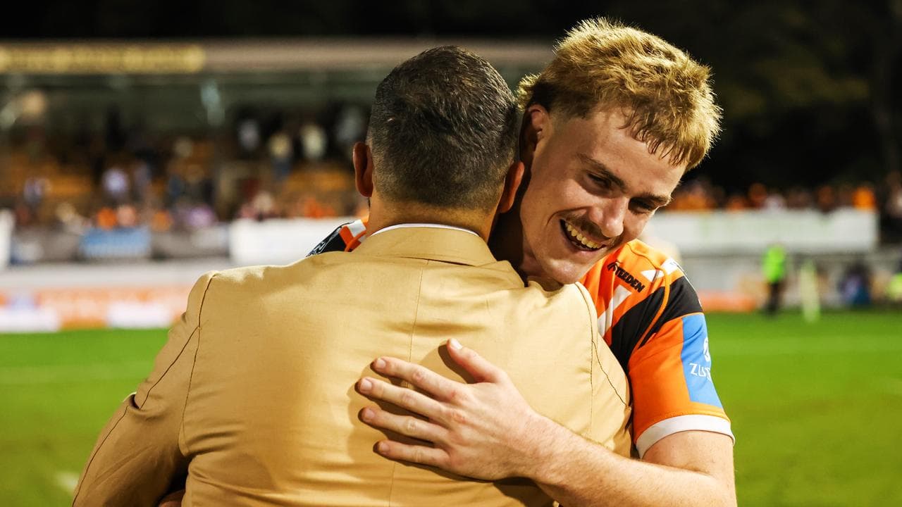 Lachlan Galvin (right) gets a warm hug from Benji Marshall