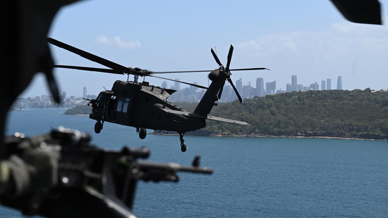 An ADF Black Hawk helicopter over Sydney Harbour.