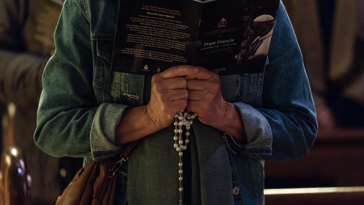 Worshippers attend a mass