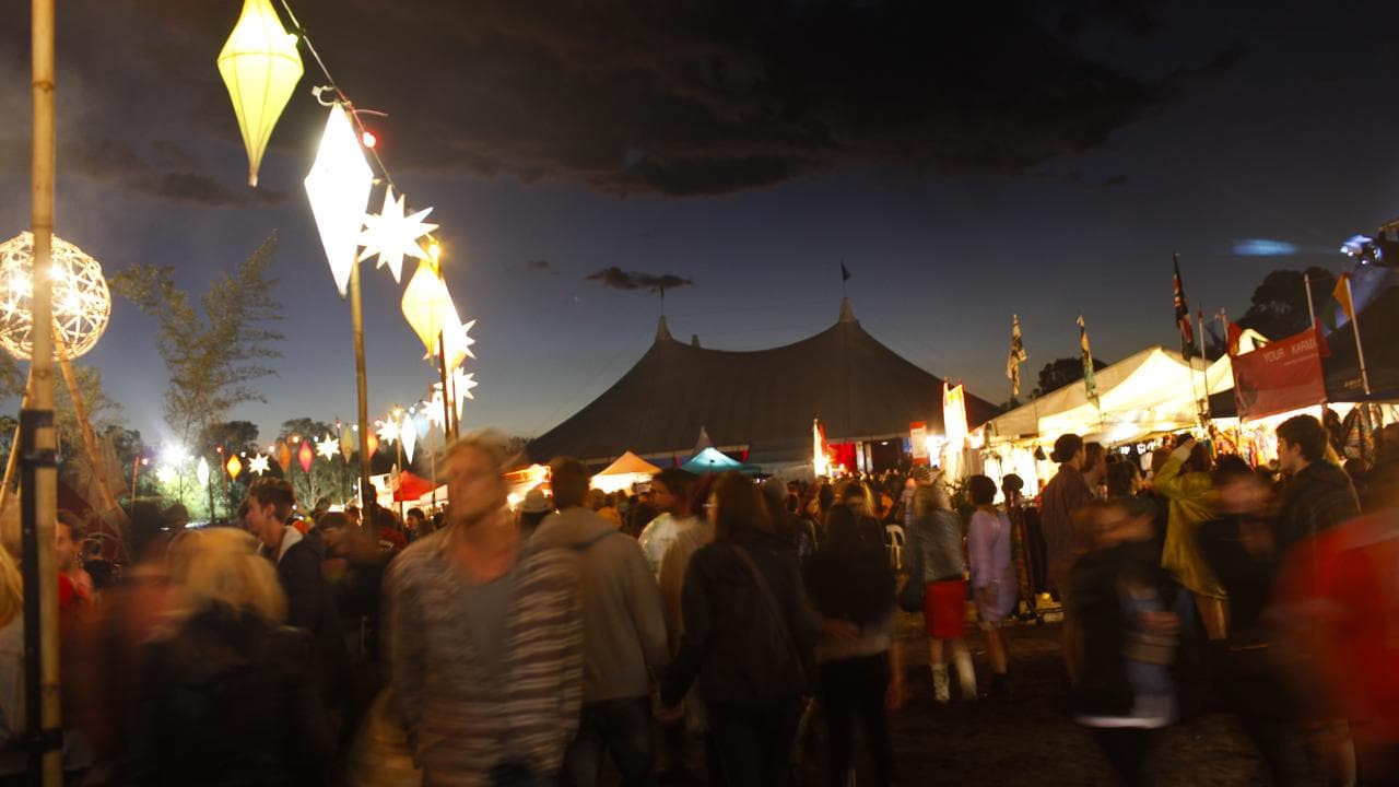 Visitors attend a music festival in Byron Bay