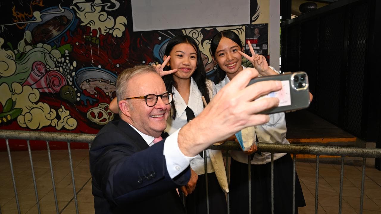 Prime Minister Anthony Albanese takes a selfie with students