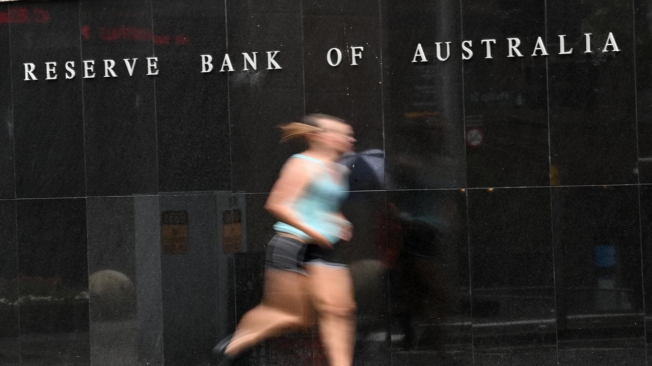Person jogs past the Reserve Bank of Australia building