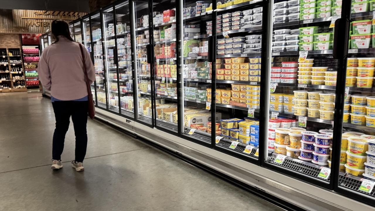 Shoppers in the dairy section of a supermarket, March 17, 2025