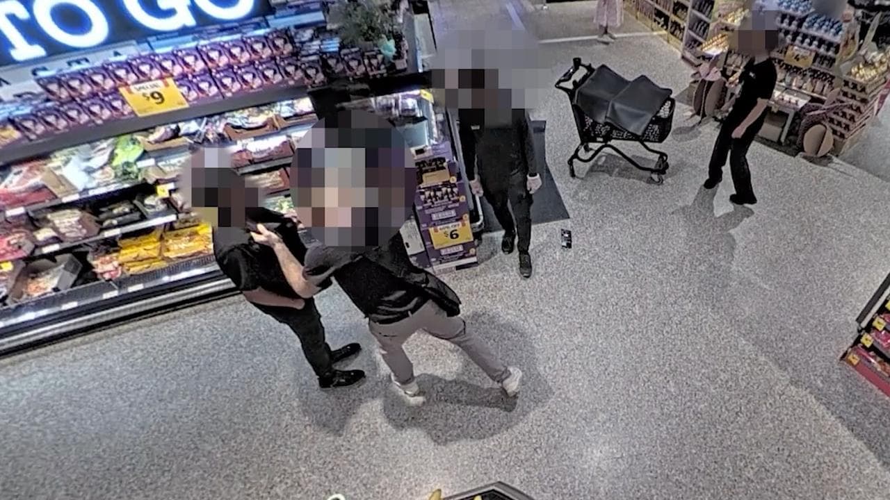 A shopper acting aggressively towards a Coles employee