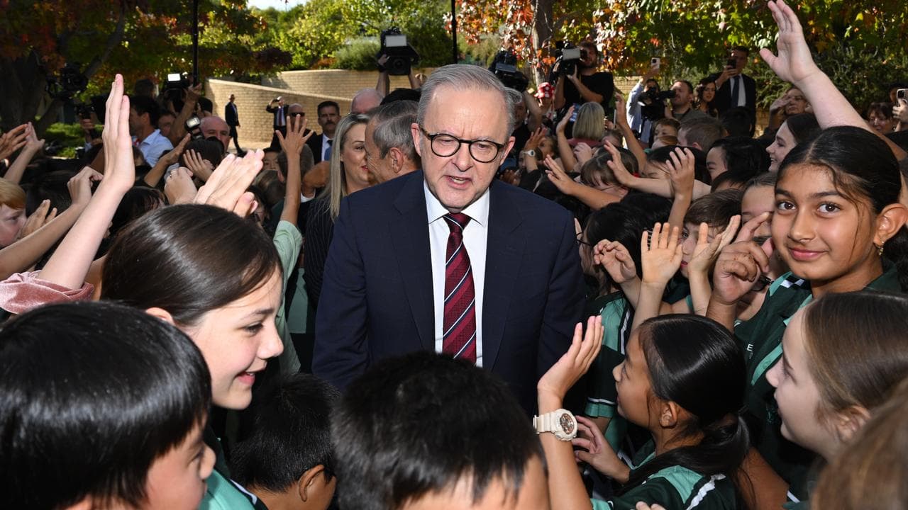 Anthony Albanese is greeted by school children in Perth
