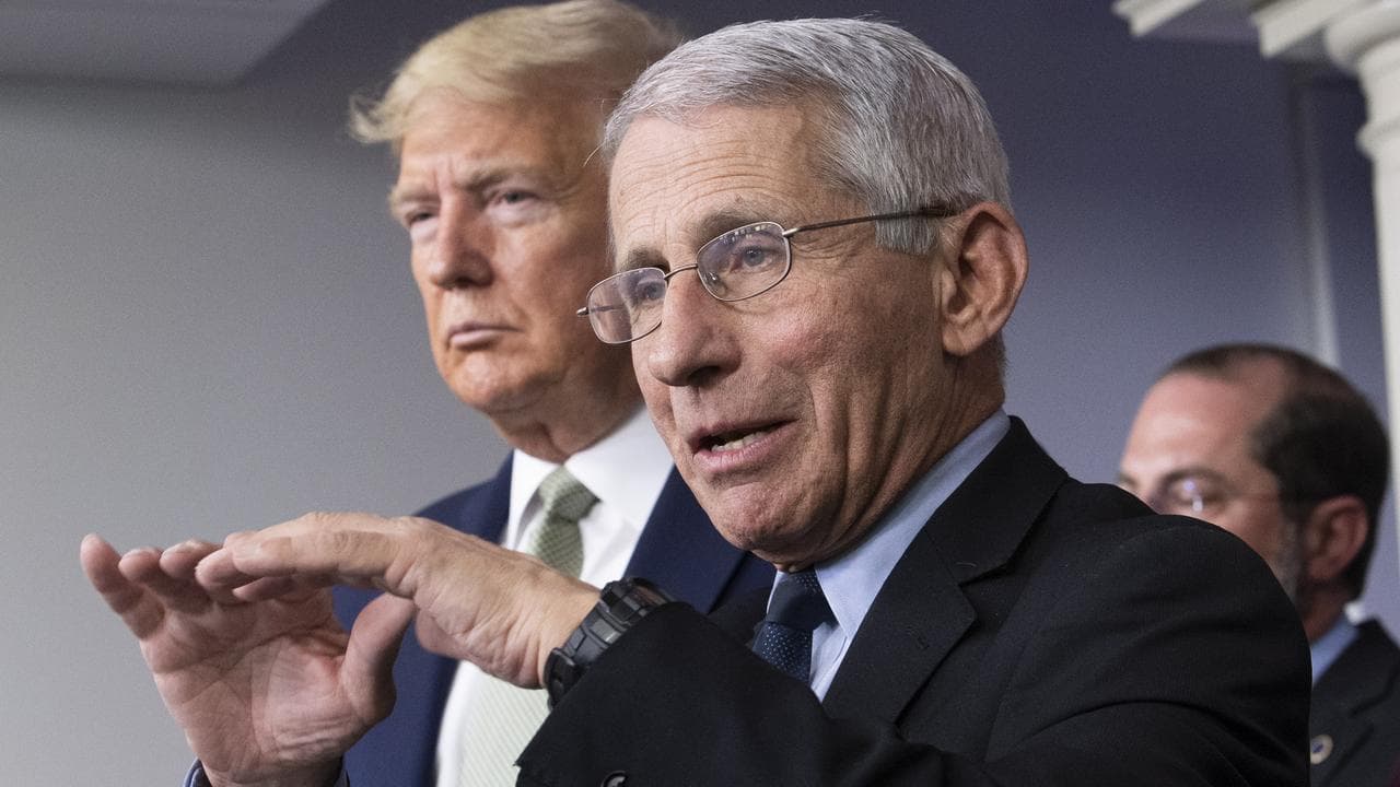 Dr Anthony Fauci (R) speaking alongside US President Donald Trump.
