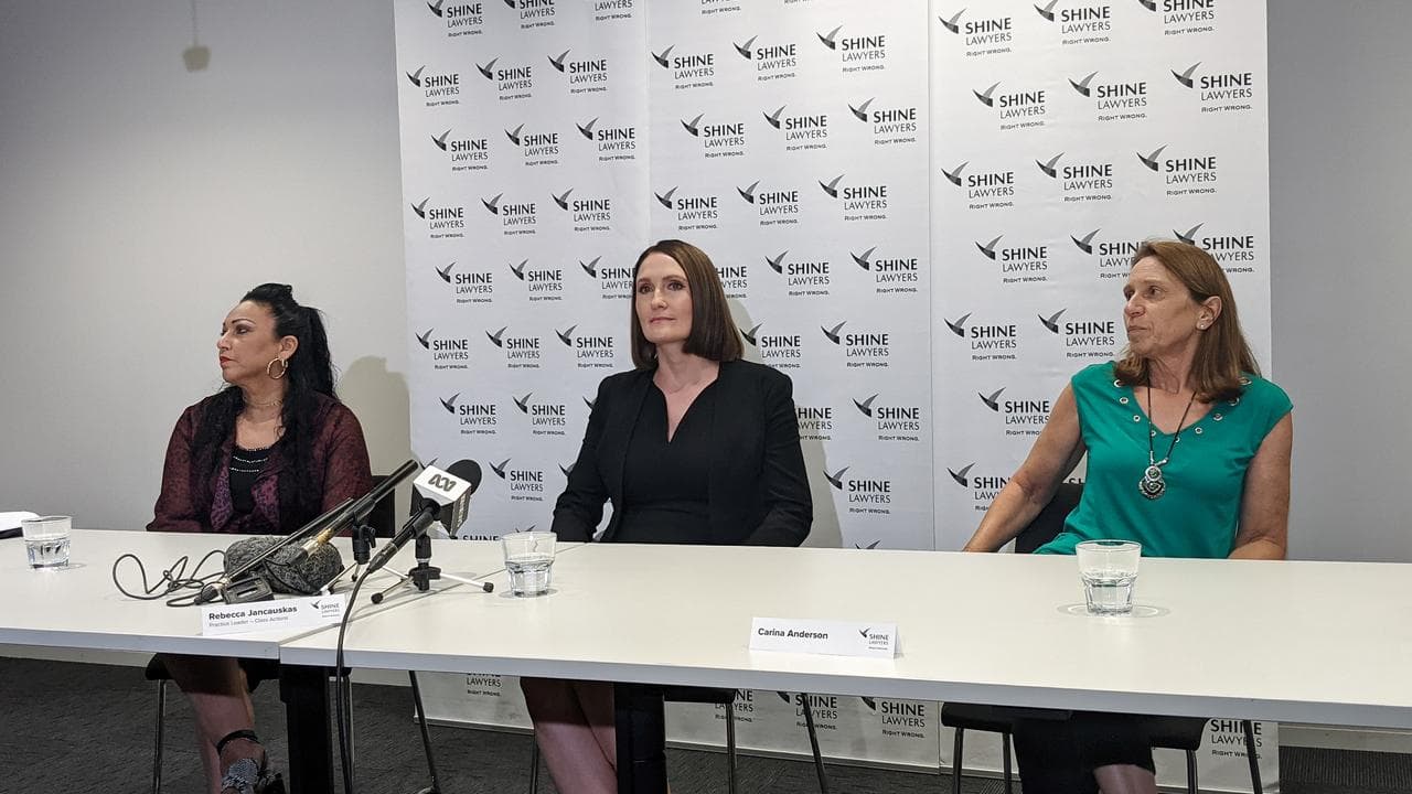 Rebecca Jancauskas of Shine Lawyers, centre, and clients