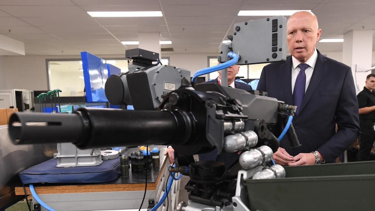 Mr Dutton pictured on a tour of a weapons facility.