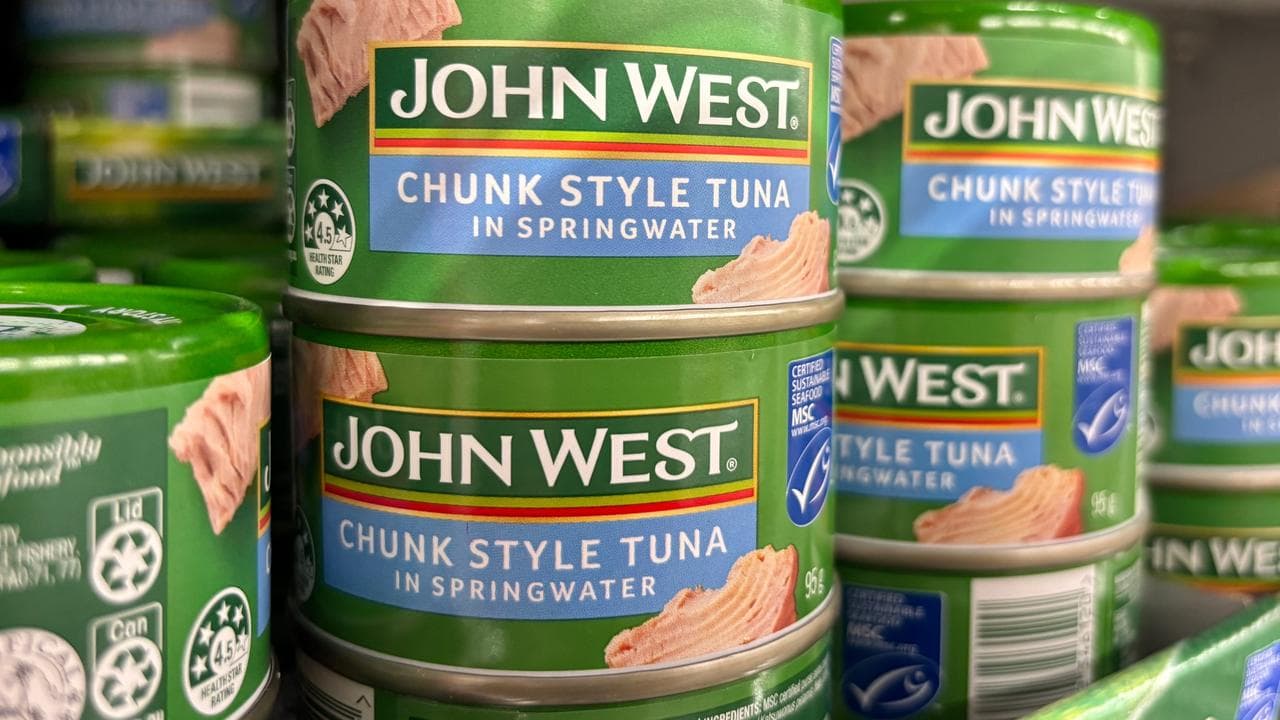 Canned tuna on a shelf at Coles
