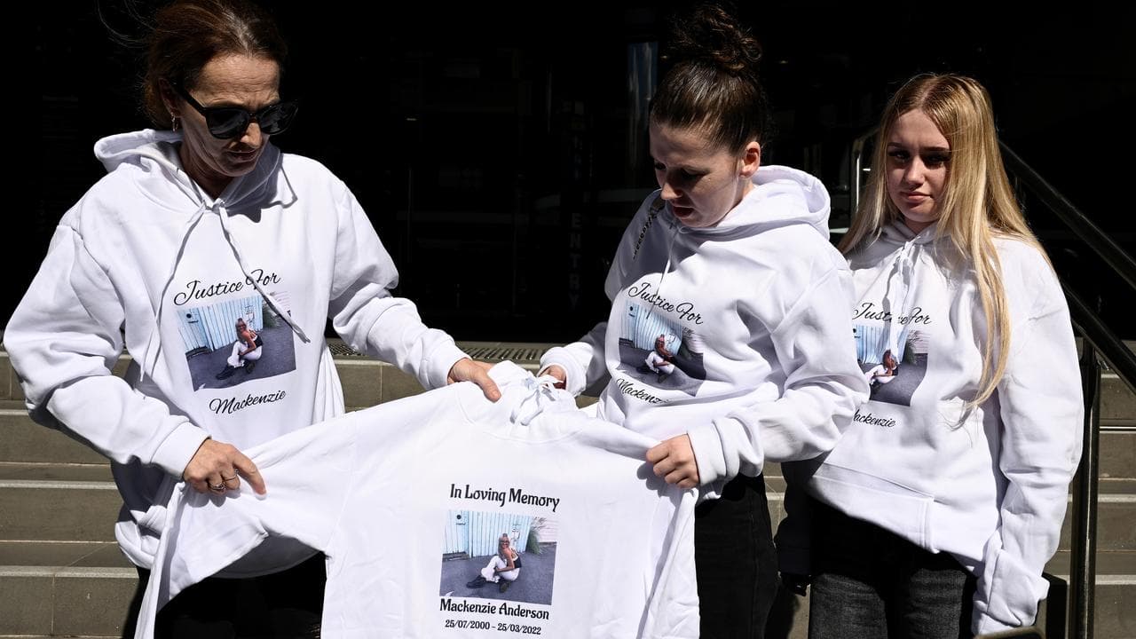 Friends of Mackenzie Anderson hold jumpers memorialising her