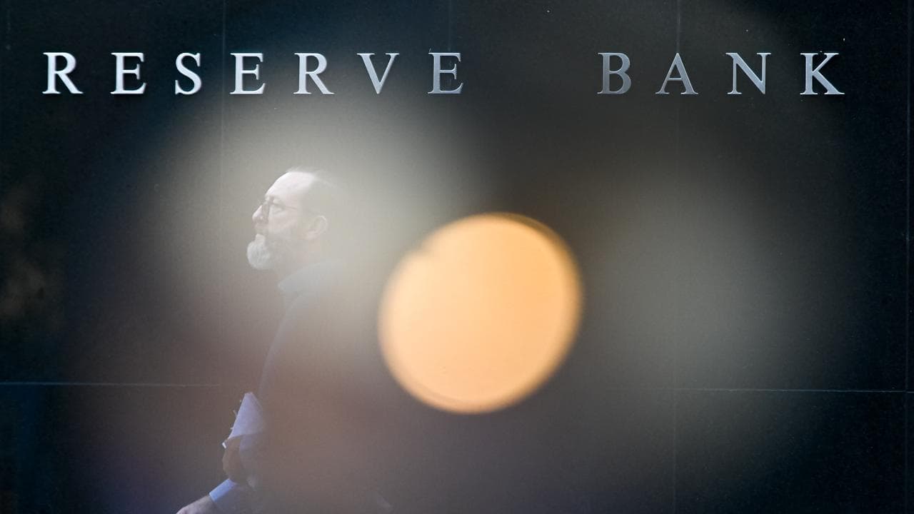 People walk past the Reserve Bank of Australia in Sydney (file image)