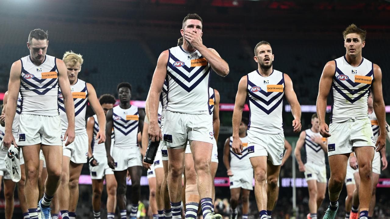 Fremantle players walk off at halftime.
