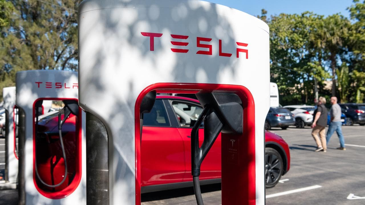 Tesla charging station and car (file image)
