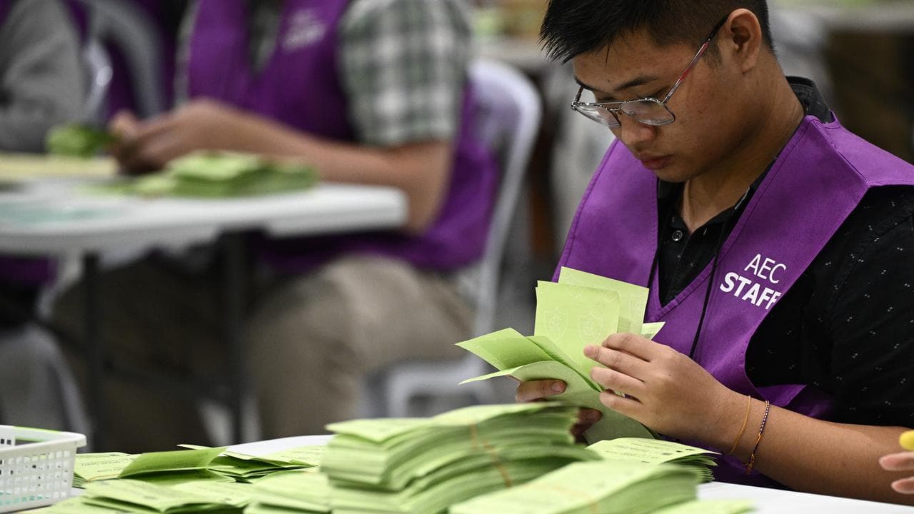 Electoral commission staff count ballots,.