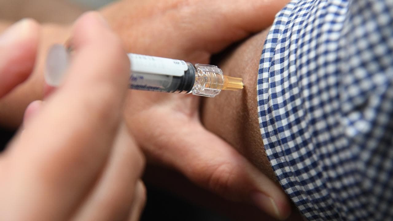 A man getting a flu vaccination (file image)