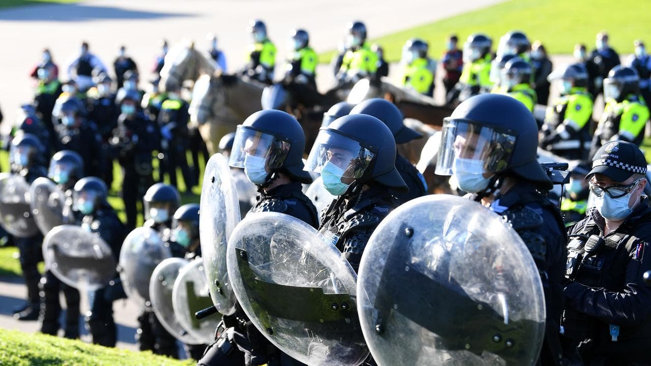 Victoria Police officers in riot gear during a COVID-19 protest
