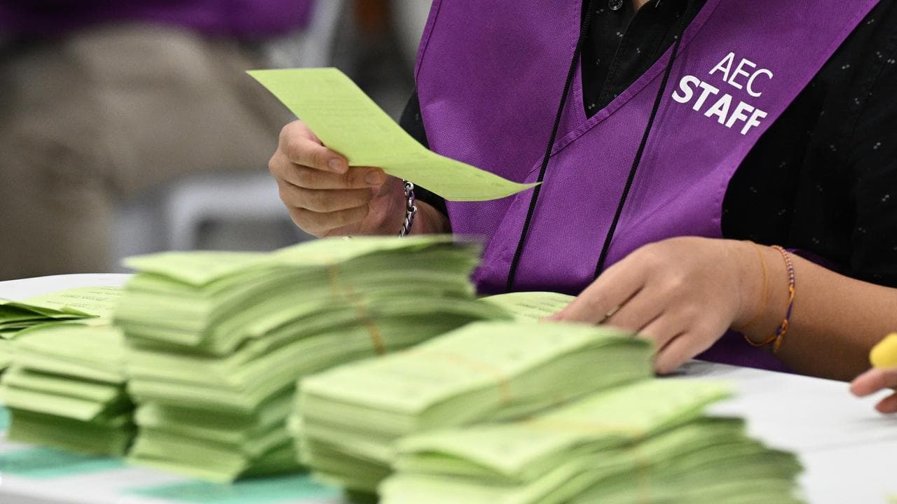 Aust Electoral Commission staff count ballots in Sydney, May 3, 2025