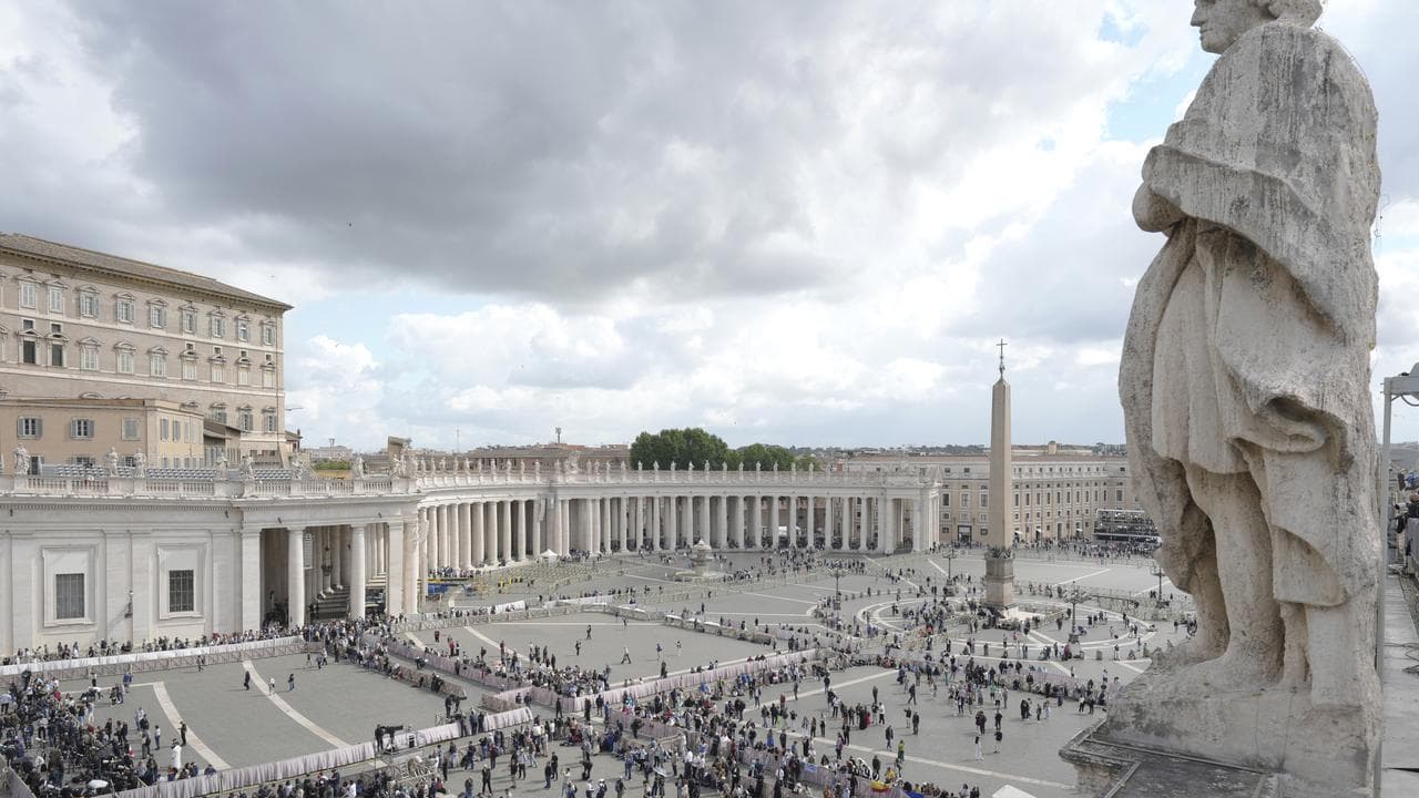People arrive at St Peter's Square at the Vatican