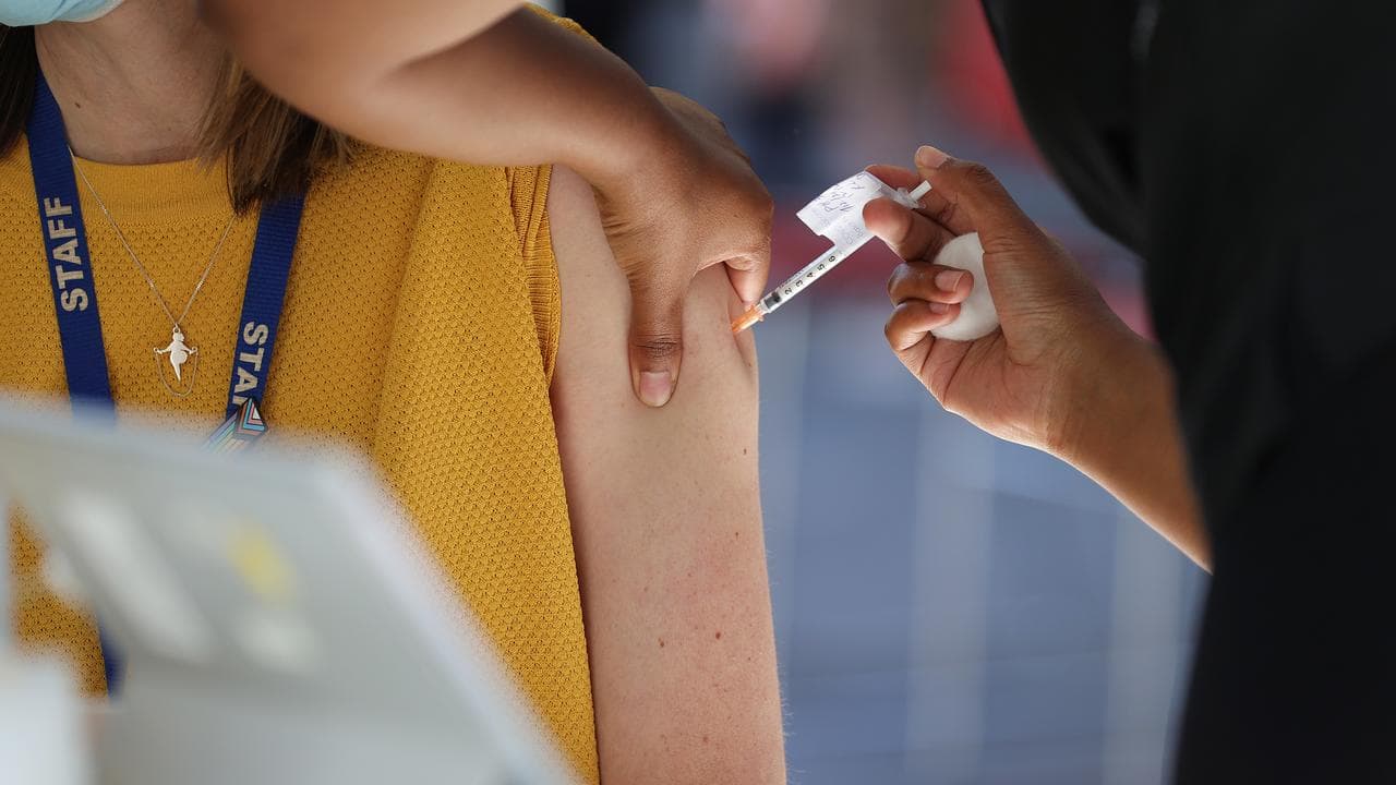 Person receiving COVID vaccination.