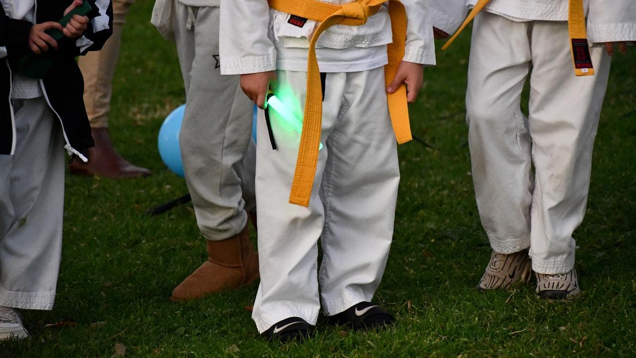 Mourners at a vigil for Sam and Max in Coonabarabran, NSW