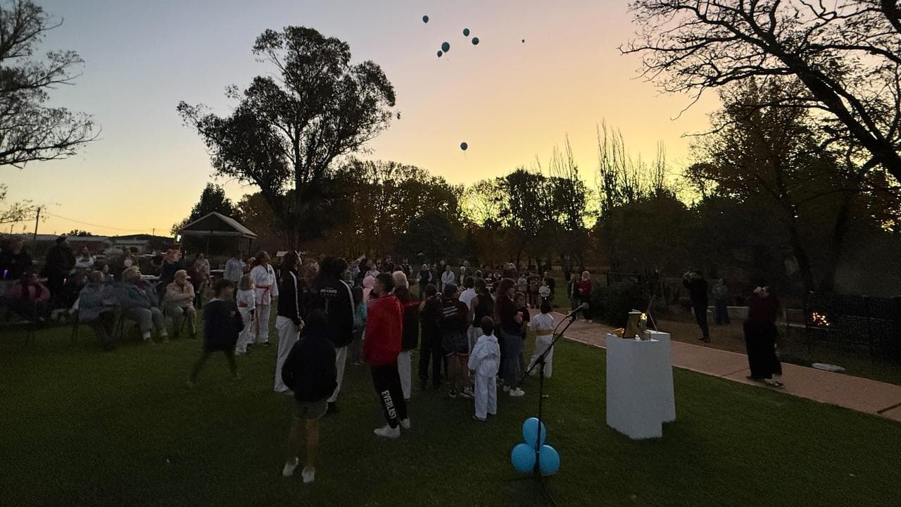A community vigil after two boys were found dead at Coonabarabran, NSW