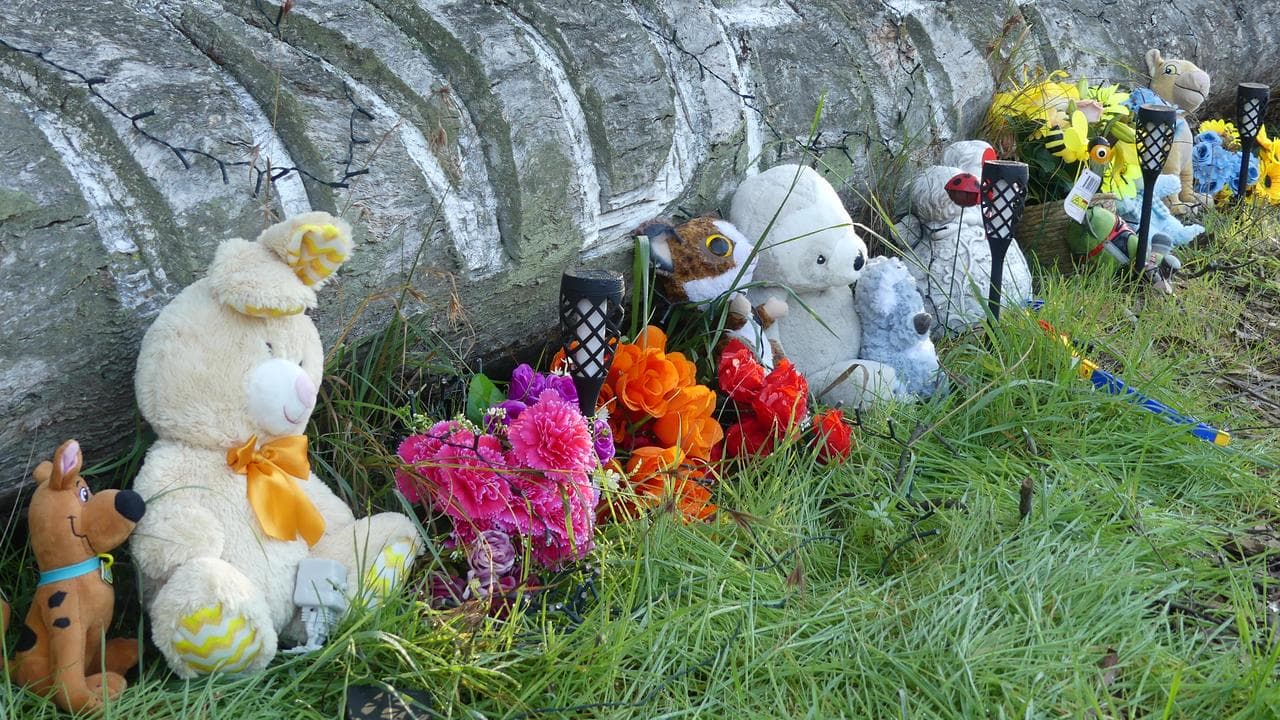 Tributes near the house where two young boys were found dead 