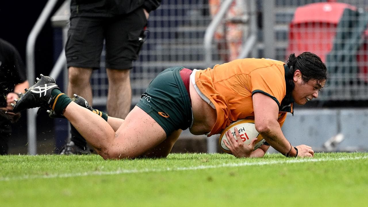 Eva Karpani of the Wallaroos scores a try.