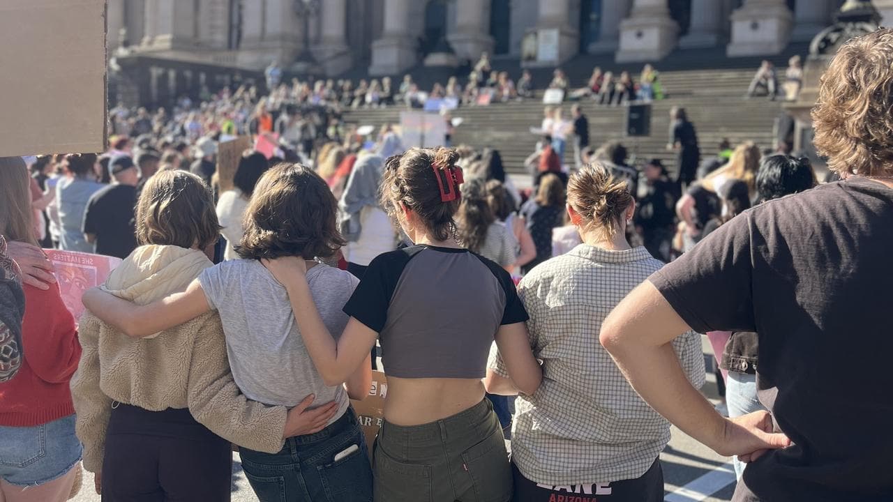 Protesters at the rally outside Parliament House in Melbourne.