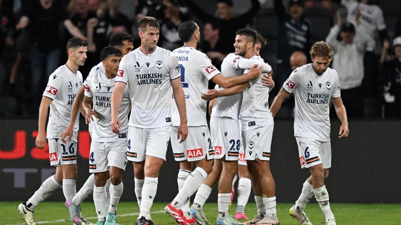 Victory teammates congratulate Zinedine Machach
