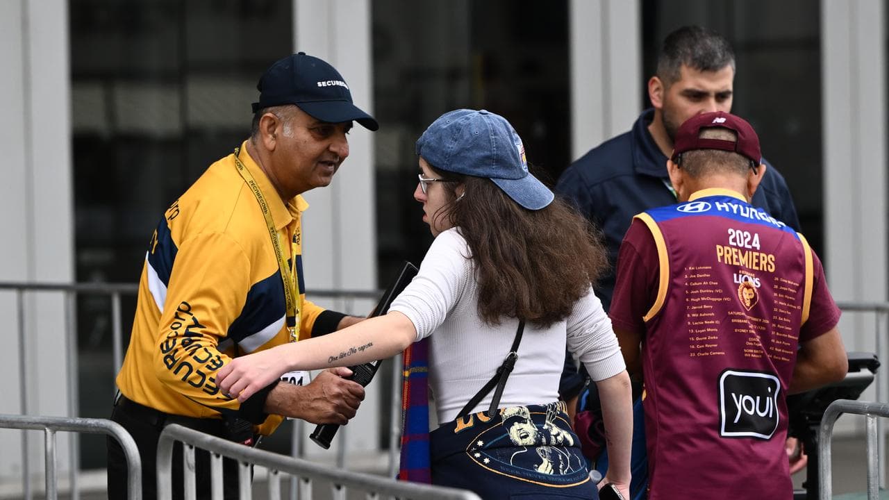 Security workers check guests (file image)