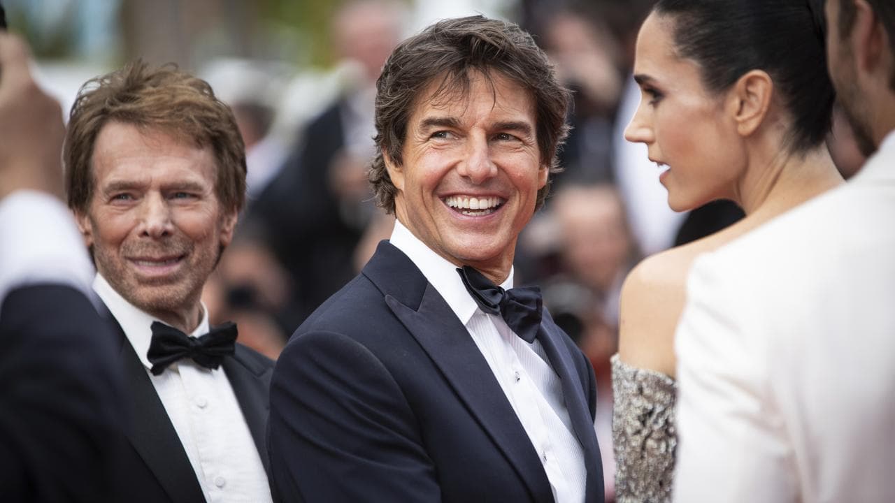 Jerry Bruckheimer, Tom Cruise and Jennifer Connelly at Cannes in 2022