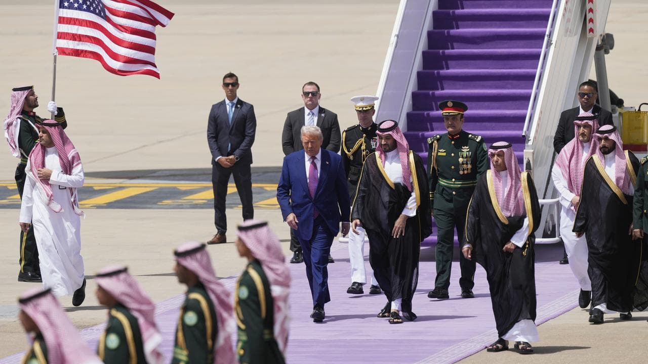 Donald Trump walks with Saudi Crown Prince Mohammed bin Salman