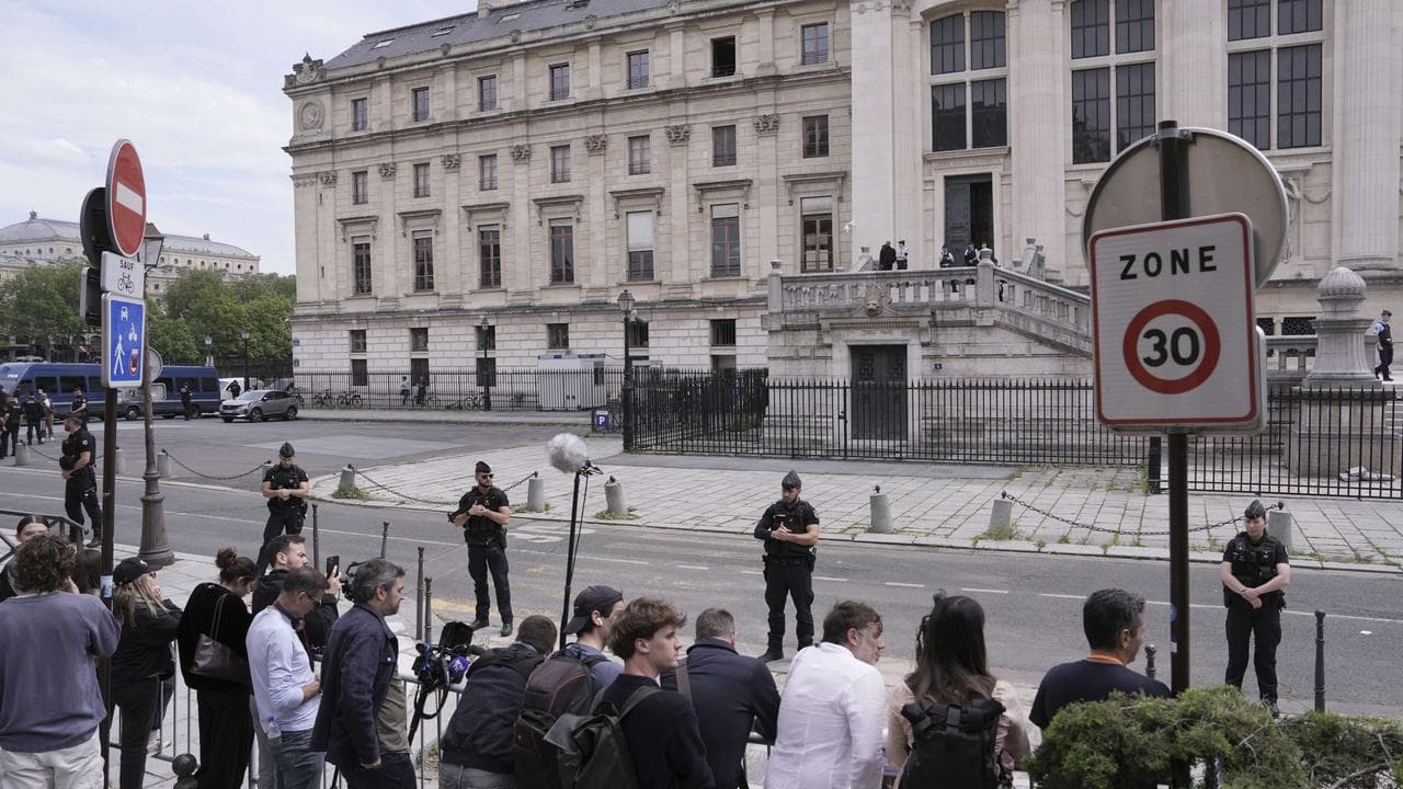 Police guard outside the palace of justice in Paris, France