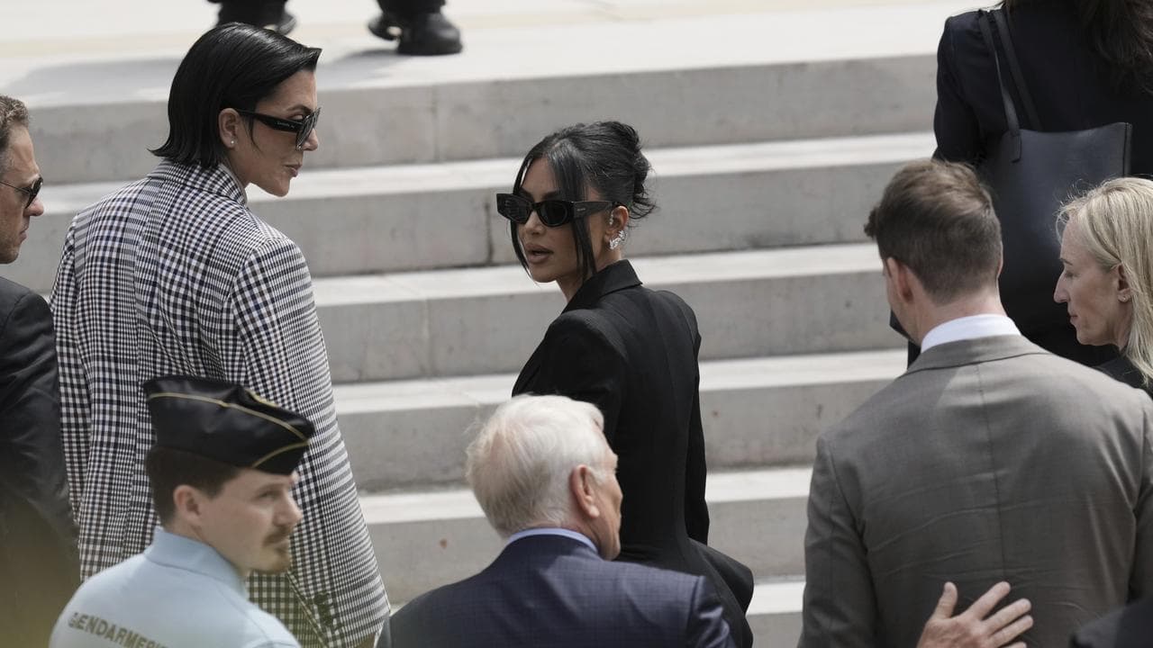 Kim Kardashian and her mother Kris Jenner, left, outside a Paris court
