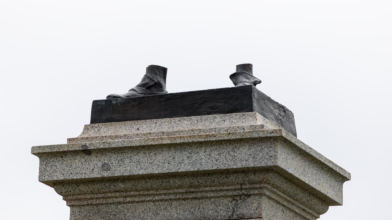 A Captain Cook statue is hacked off at the ankles (file image)