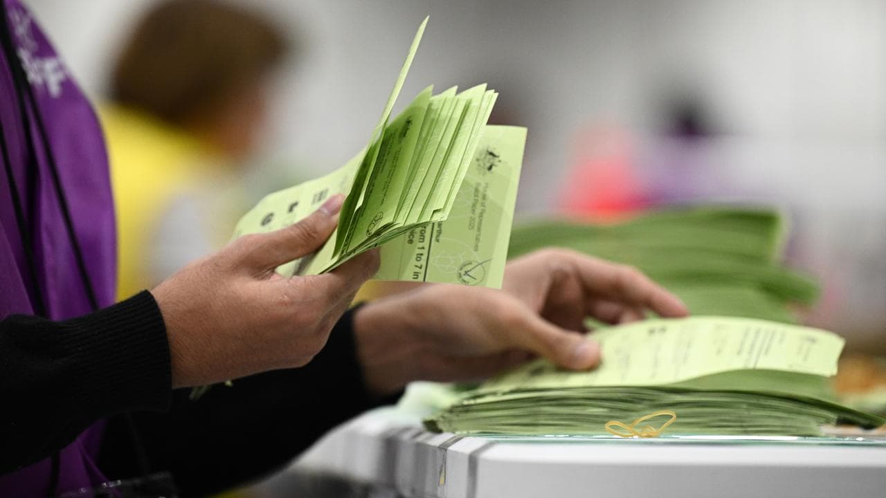 Australian Electoral Commission staff count ballots