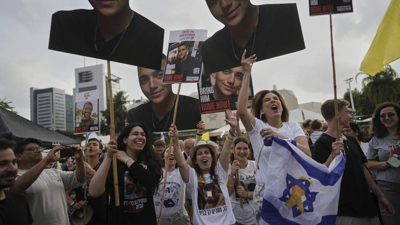 Israelis watch a broadcast of Edan Alexander being released by Hamas