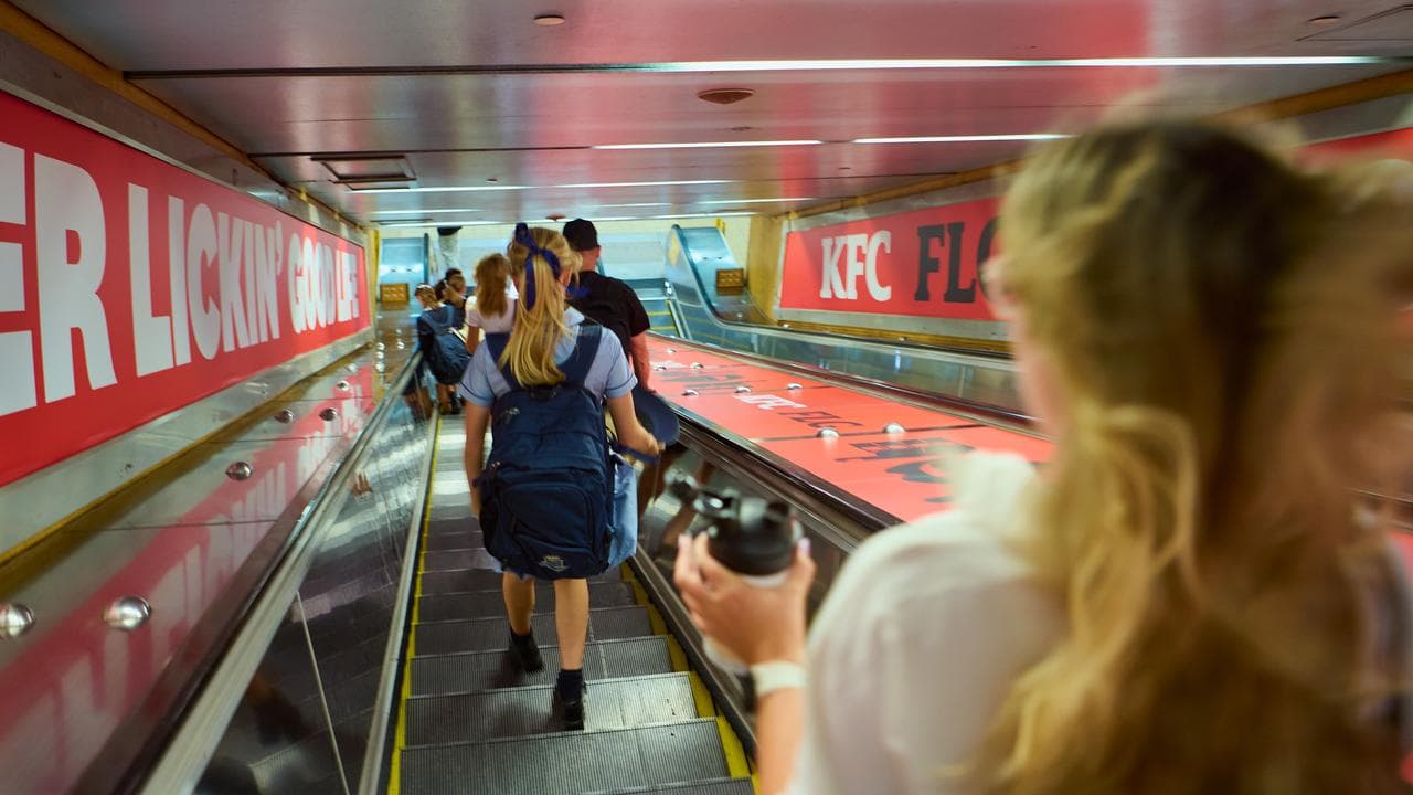People in train station