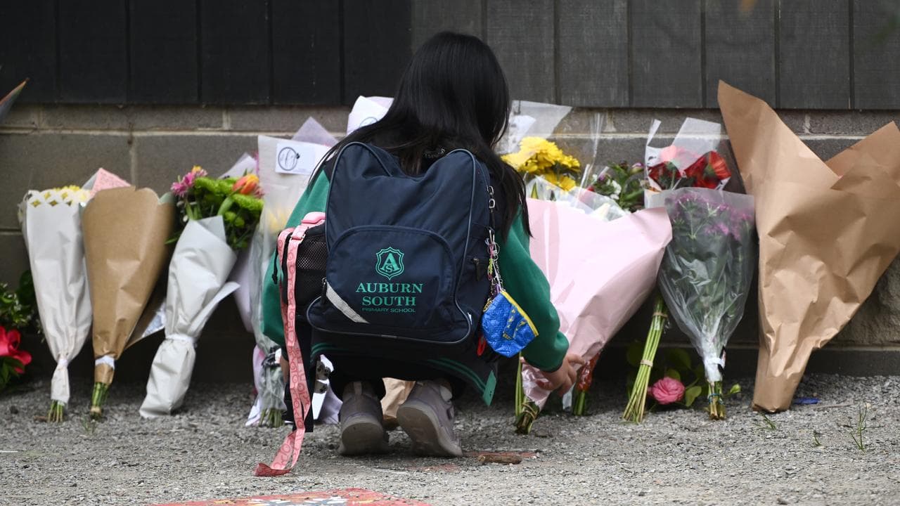 A student with a floral tribute (file image)