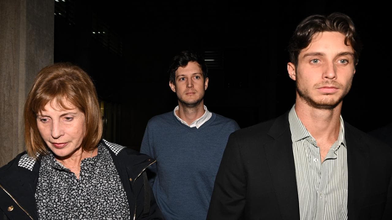 Rory Amon (centre) leaves Surry Hills Police Centre