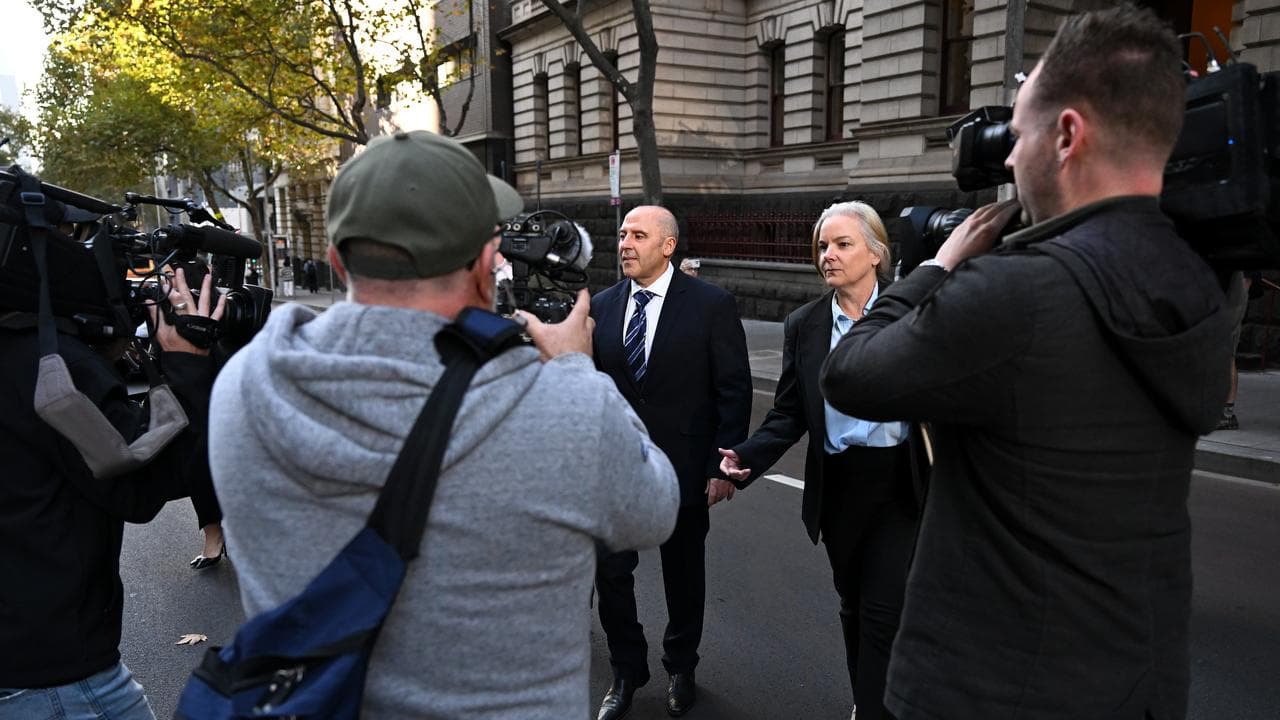 Tony Mokbel (centre) departs from the Court of Appeal