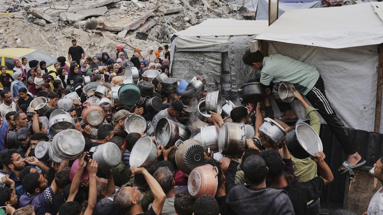 Palestinians clamour for food in Jabalia, northern Gaza Strip