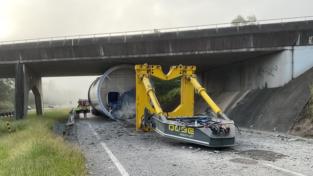 Wind turbine tower stuck under highway overpass