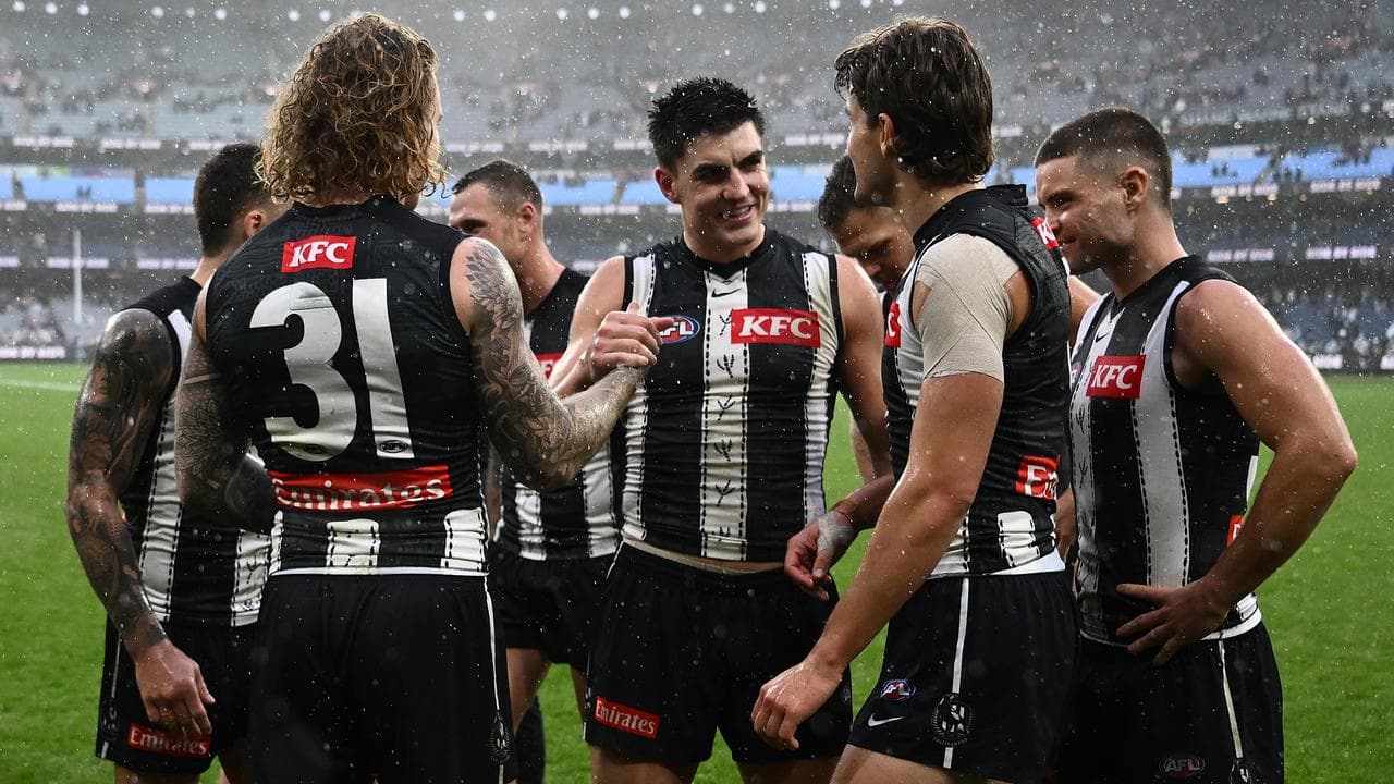 Brayden Maynard (centre) and teammates celebrate