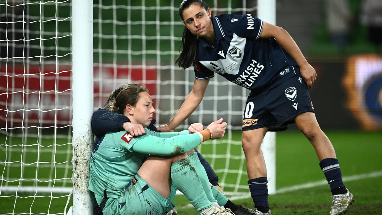 Victory's Alex Chidiac consoles keeper Courtney Newbon.
