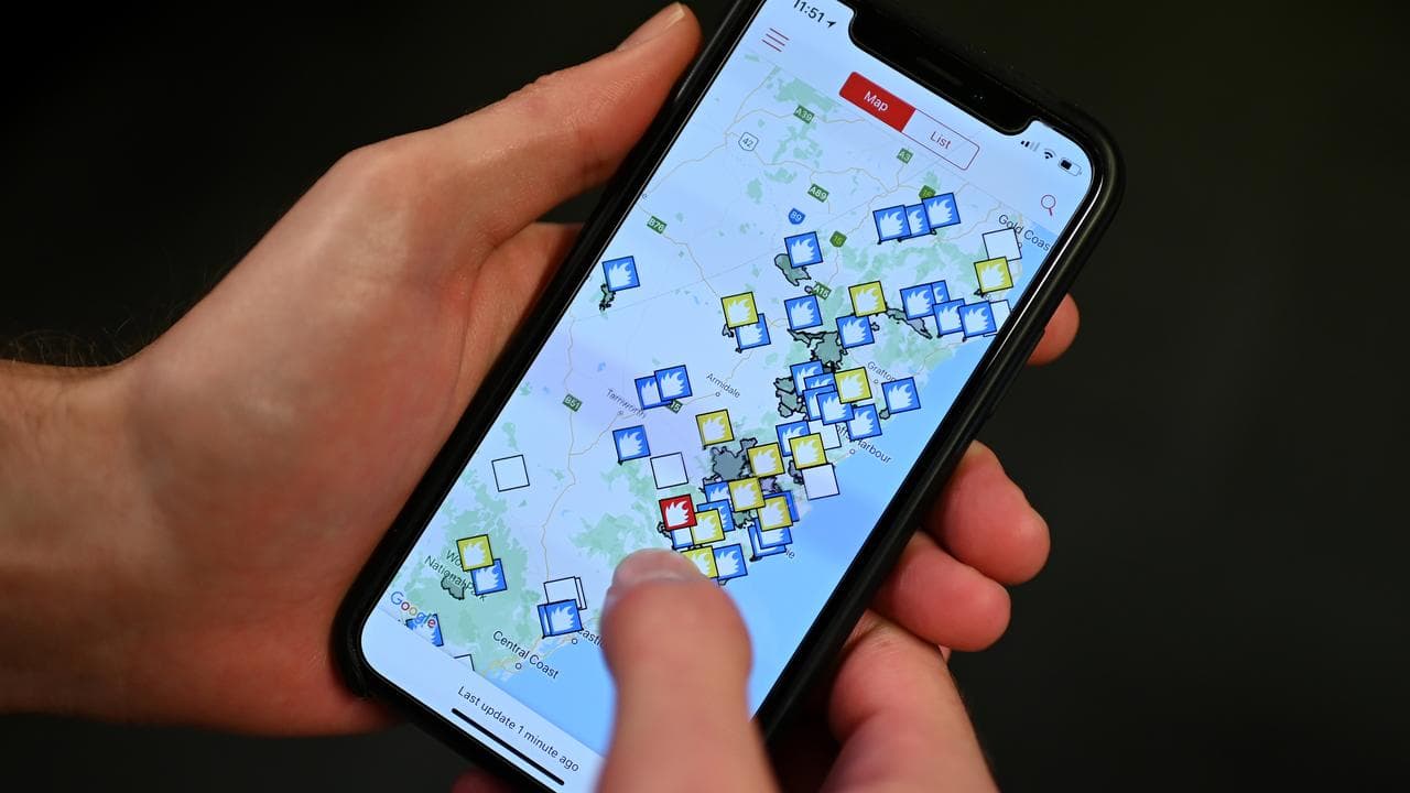 A smartphone displays a bushfire app (file image)