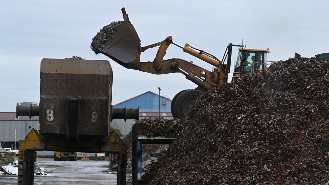 A front loader collects metal to be melted