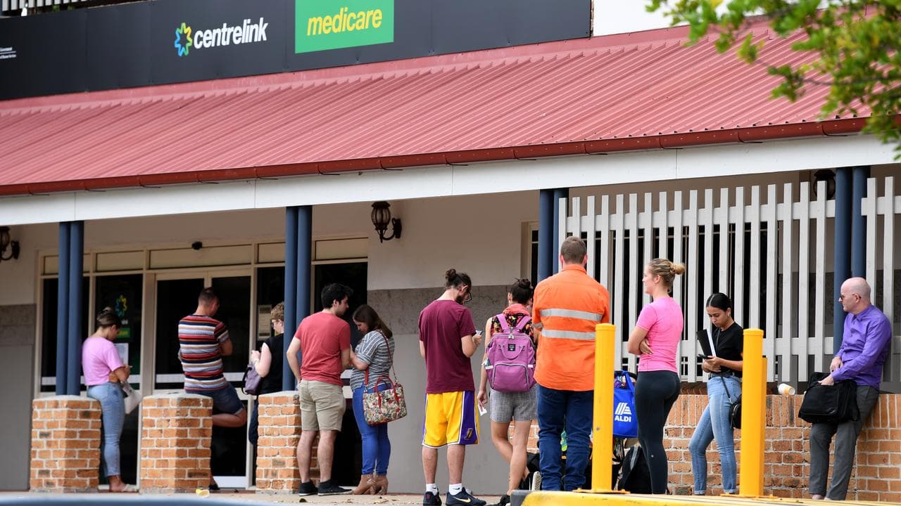 People queue outside a Centrelink office (file image)