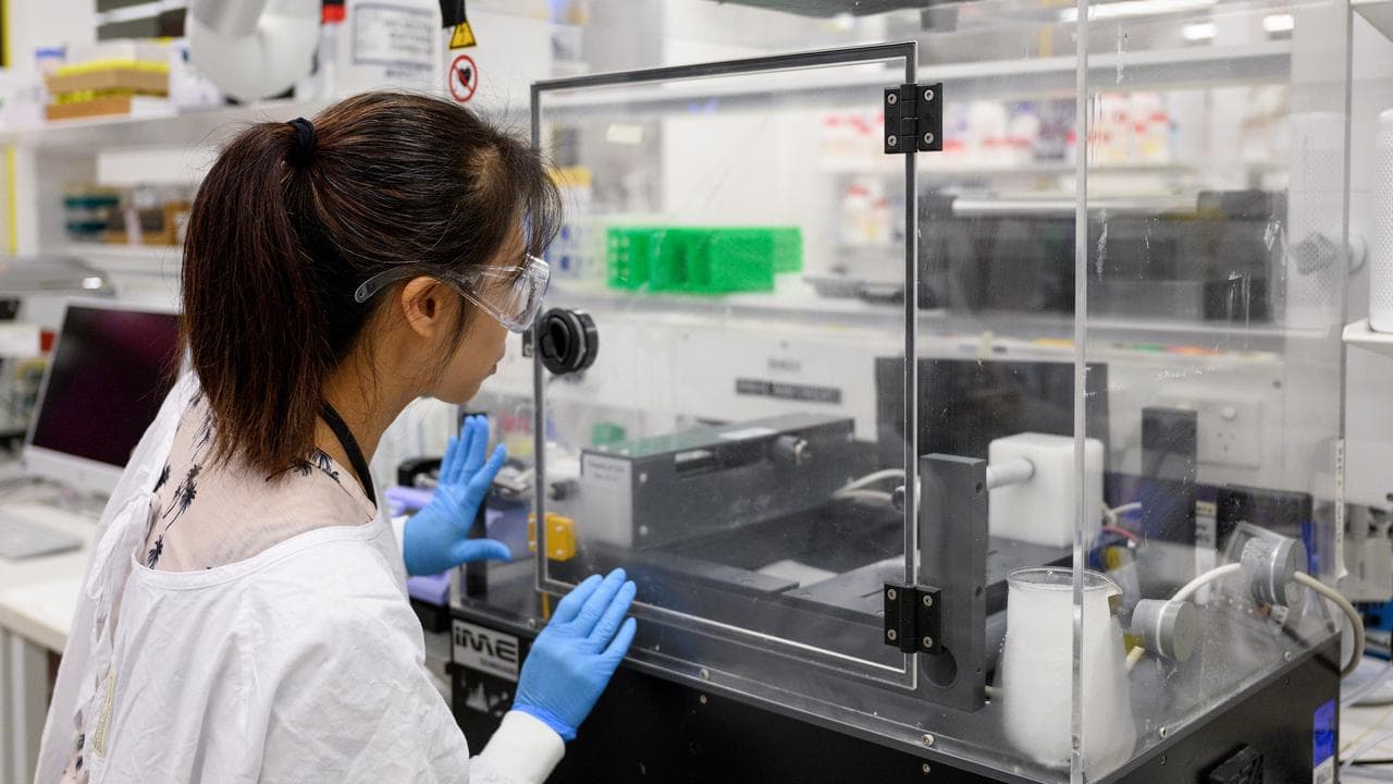 Laboratory manager with a machine at the Charles Perkins Centre